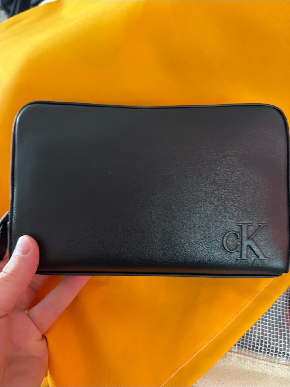 Calvin Klein Black Leather wristlet with Embossed CK